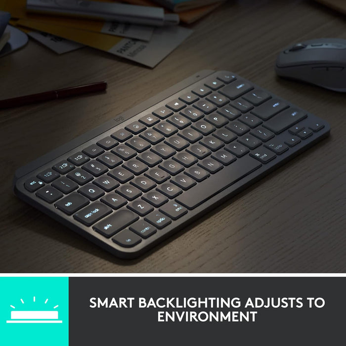 Keyboard with smart backlighting on a desk with text 'Smart Backlighting Adjusts to Environment'.