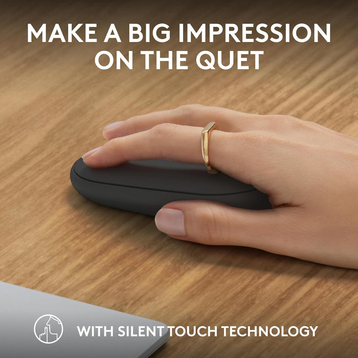 Hand using a black computer mouse on a wooden desk with text about silent touch technology.