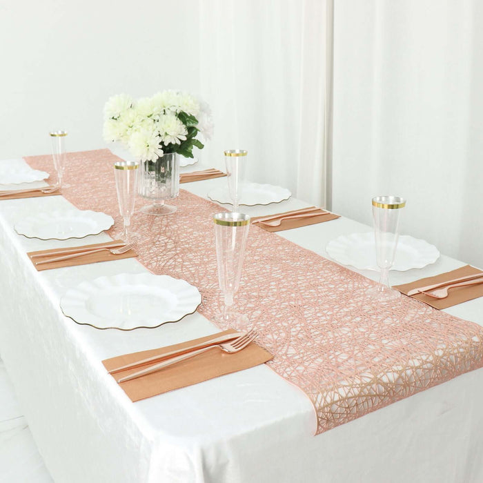 Elegant table setting with peach runner, plates, and glasses for a special occasion.