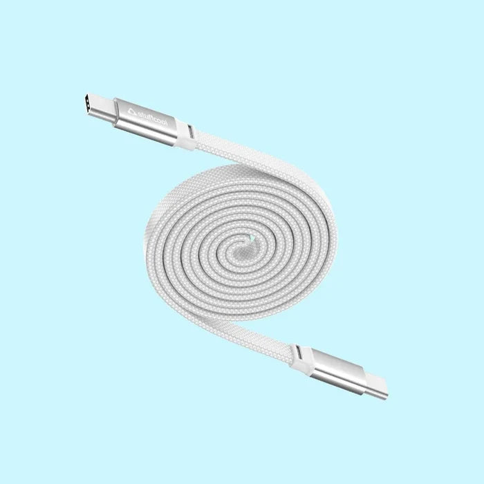 A white braided USB-C to USB-C cable coiled in a spiral, featuring silver metal connectors, set against a solid light blue background.
