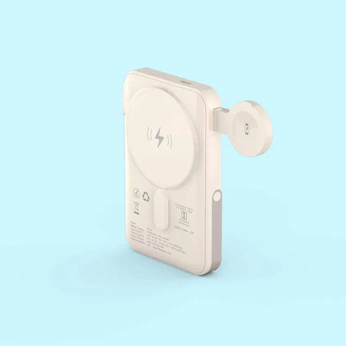 A compact, off-white portable power bank with a circular magnetic wireless charging pad on the back and an attached side connector, shown on a light blue background.